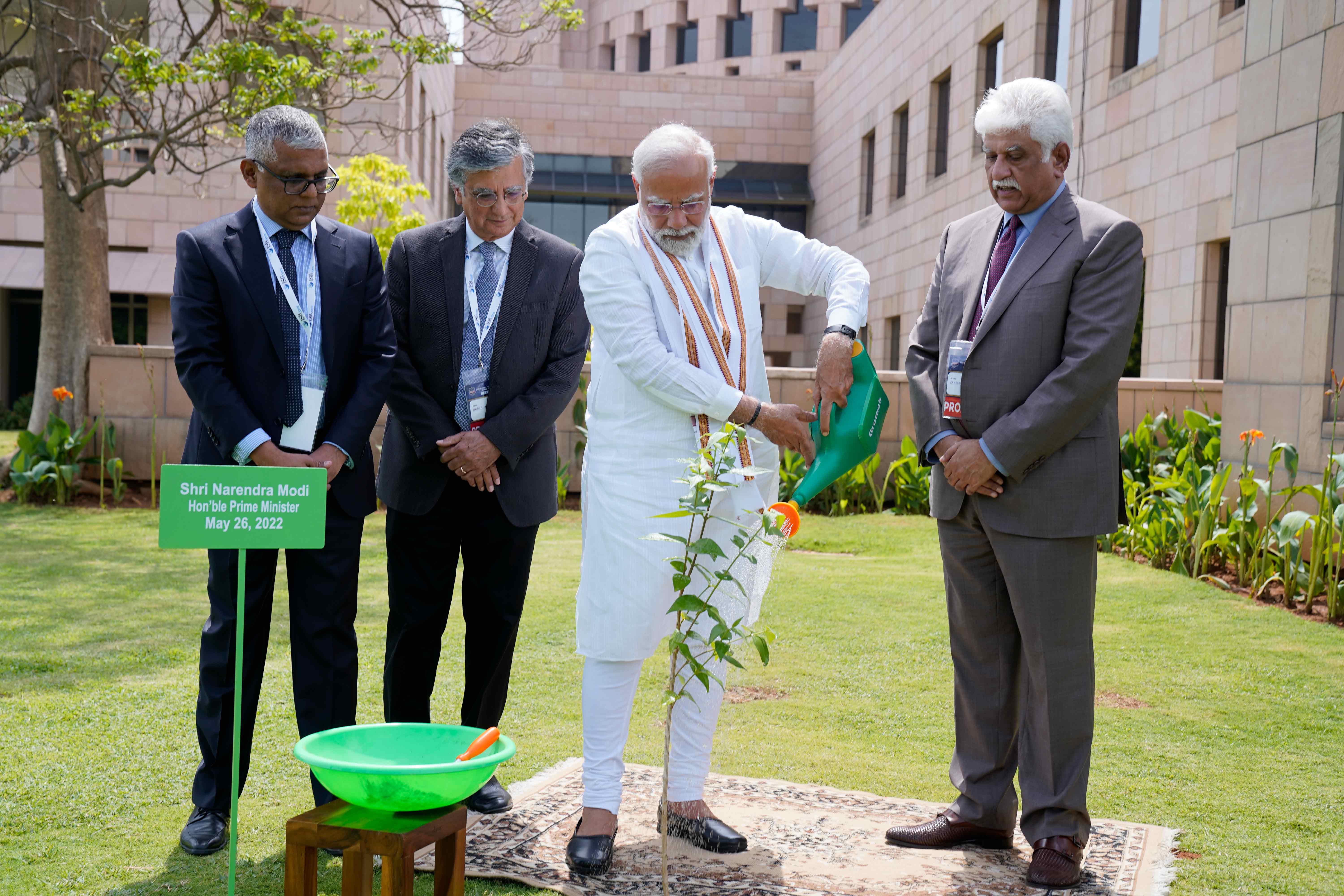 In keeping with ISB traditions, PM Narendra Modi plants a sapling as ISB Dean Madan Pillutla, Chairman Harish Manwani and Executive Board member Rakesh Bharti Mittal (L-R) looks on   