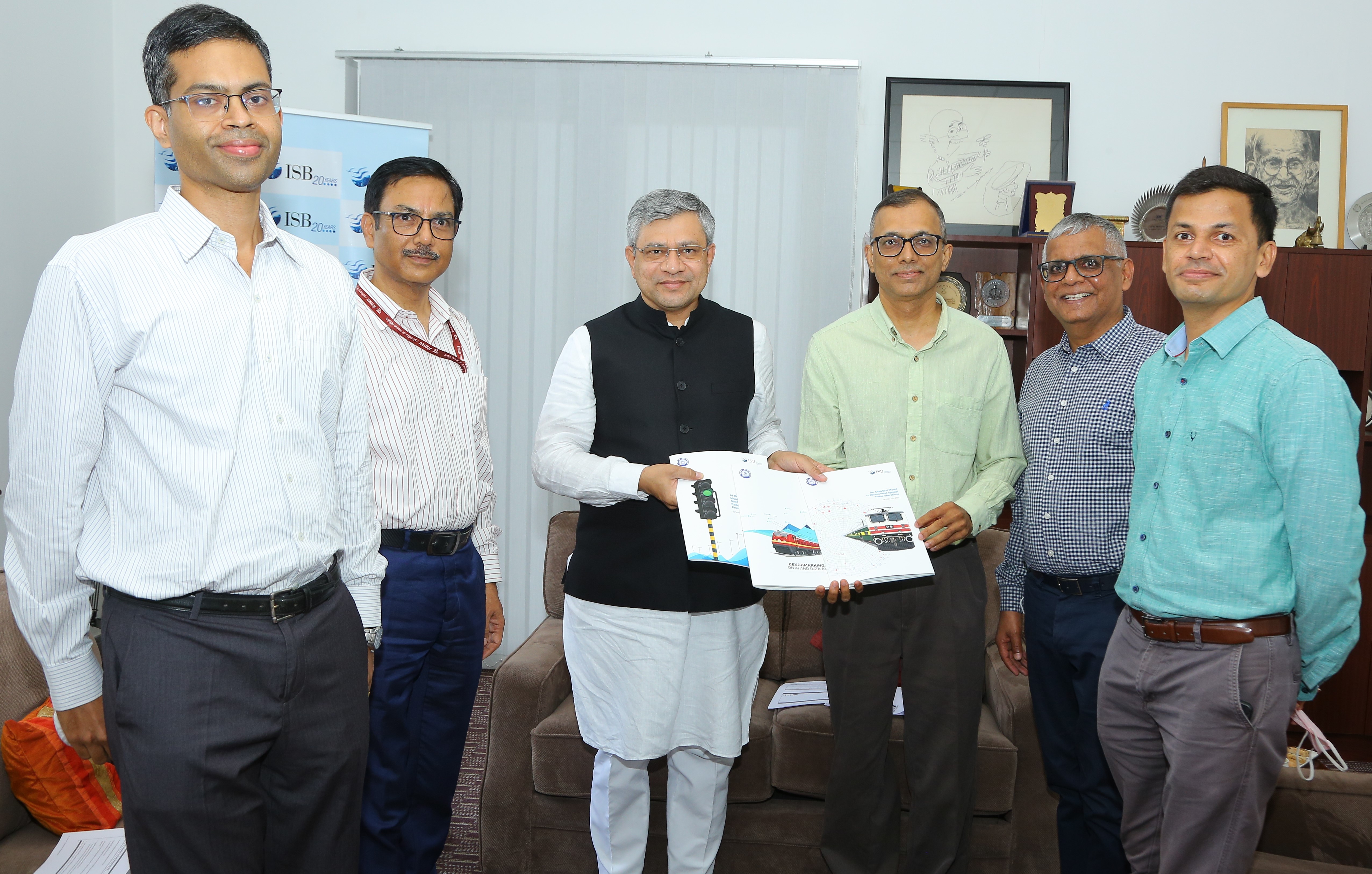 Milind Sohoni, Professor of Operations Management, ISB,  presenting a copy of research reports on Indian Railways prepared by ISB faculty to the Hon'ble Railways Minister, Shri Ashwini Vaishnaw.